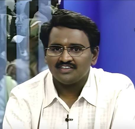 Dr Raju B